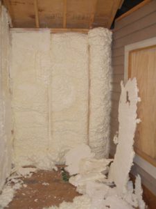 Open cell foam before being trimmed in wall cavities.